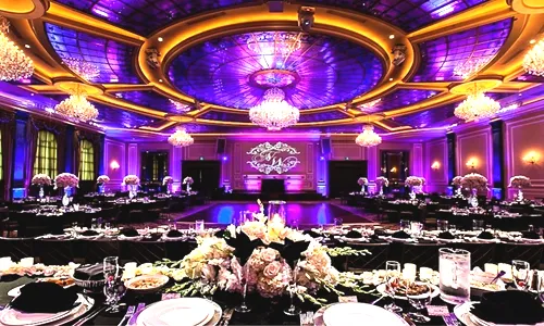 A grand wedding set for an event with purple lighting, showcasing wedding venues on an Asian directory.