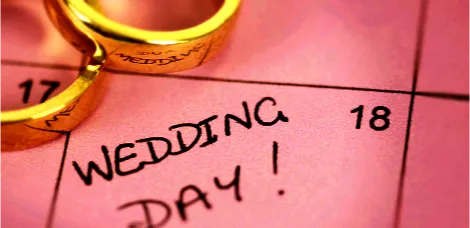 A calendar marking a wedding day with rings, for planning Asian weddings via a wedding event organiser at Asian Directory.