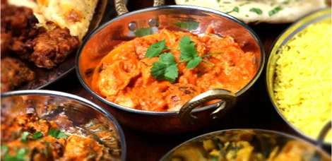 An array of Indian dishes, representing Asian food businesses or asian caterers on a directory.
